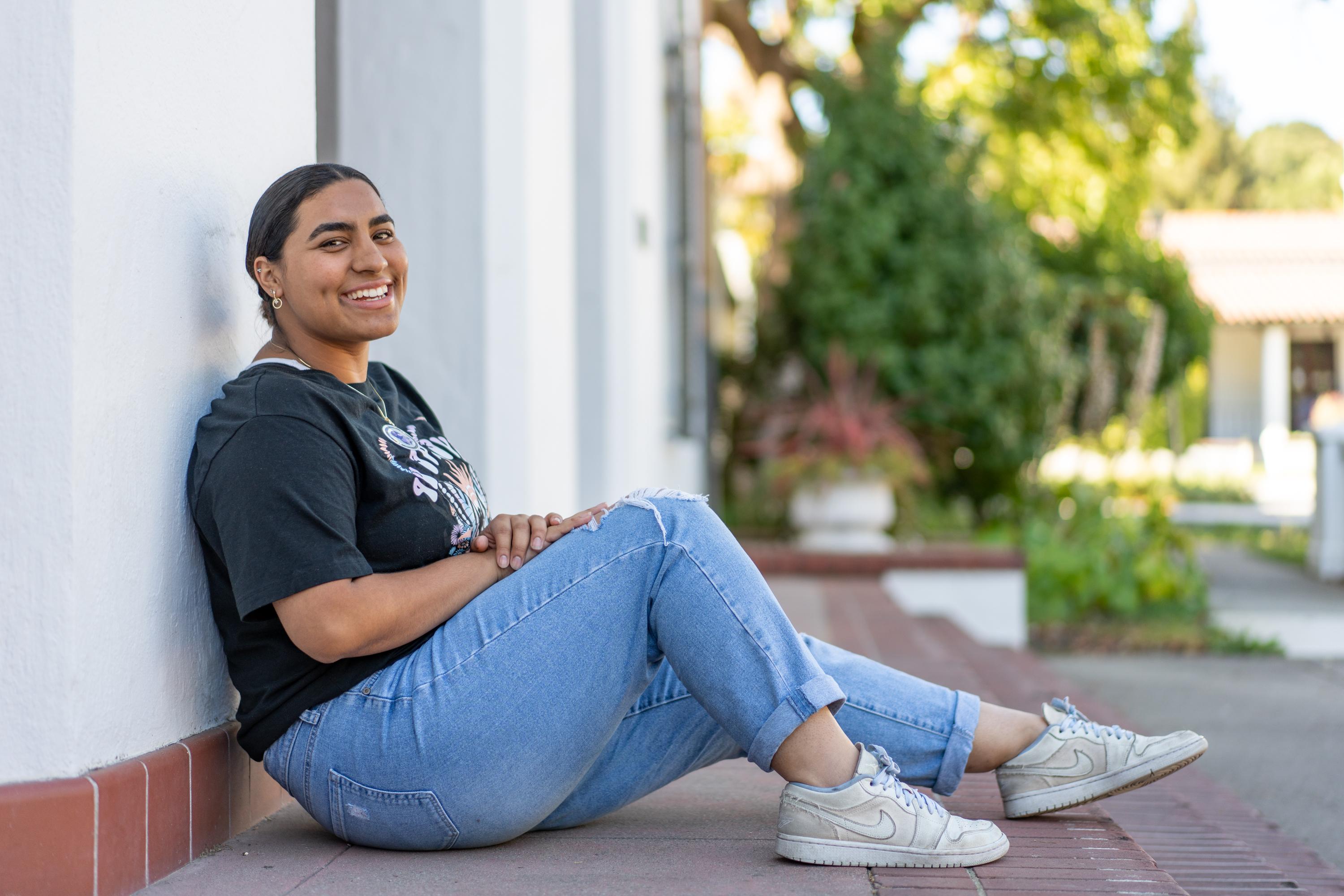 Rebecca Carranza seated on the chapel steps