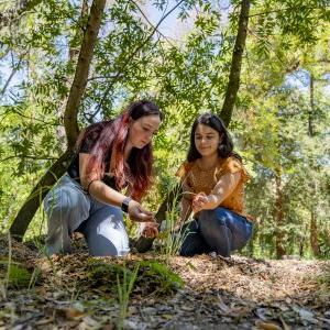 2 Science students doing field research in hills