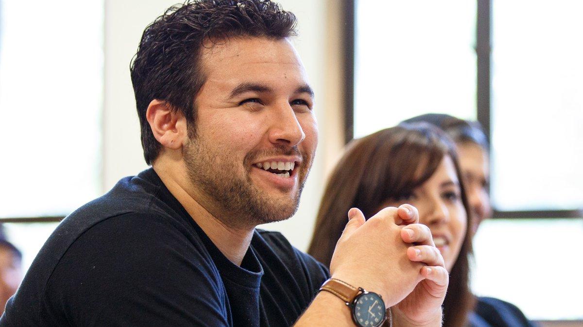 A student laughing in a business class